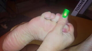 The stepmother allowed the stepson to watch as she lubricates her feet with cream